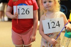 Little girls show off their walk numbers